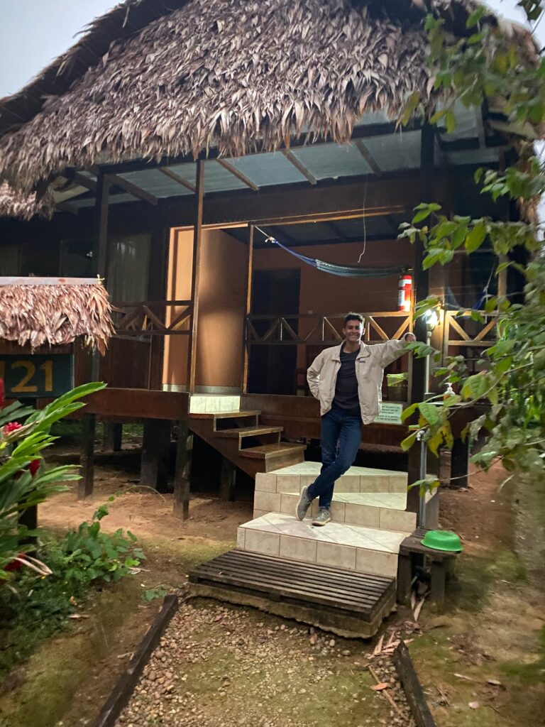 My son in our candlelit hut at Tambopata