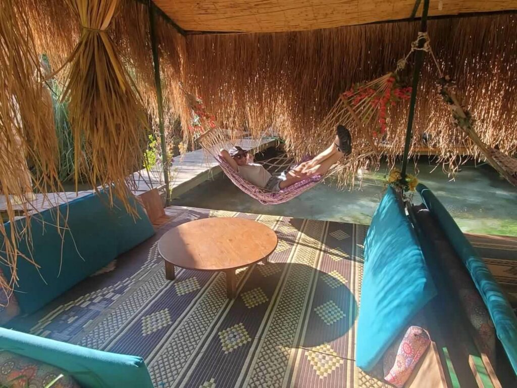 Rachel Stankovic, Travel Designer of European Travel laying in a hammock in straw hut in Turkey